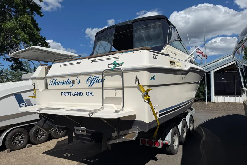 Slide: The Image of 1987 Sea Ray 300 Weekender boat named "Thursday's Office" in Portland, Oregon, on a trailer. - 19