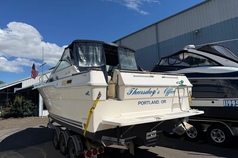 Slide: The Image of 1987 Sea Ray 300 Weekender boat named "Thursday's Office" in Portland, Oregon, on a trailer. - 20