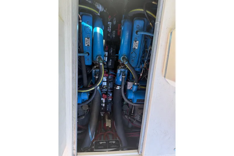Slide: The Image of Engine compartment of a 1987 Sea Ray 300 Weekender boat, showcasing dual engines. - 21