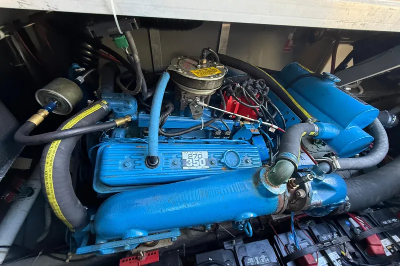 Slide: The Image of Engine of a 1987 Sea Ray 300 Weekender boat, showcasing detailed components. - 22