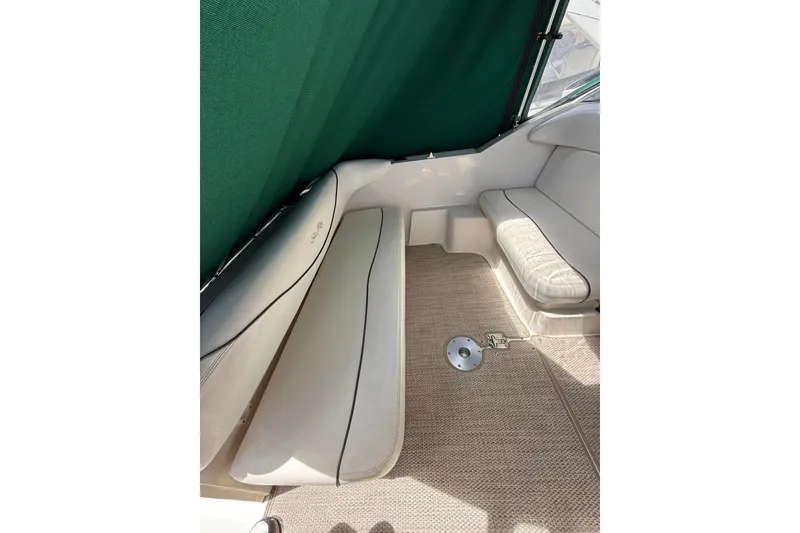 Slide: The Image of Interior seating of 2004 Sea Ray 240 Sundancer boat with green canopy. - 9
