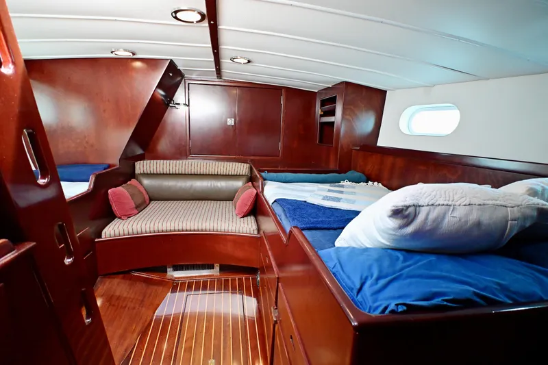 Slide: The Image of Luxurious wooden interior of a 1968 Abeking & Rasmussen Tripp 74 yacht cabin. - 19