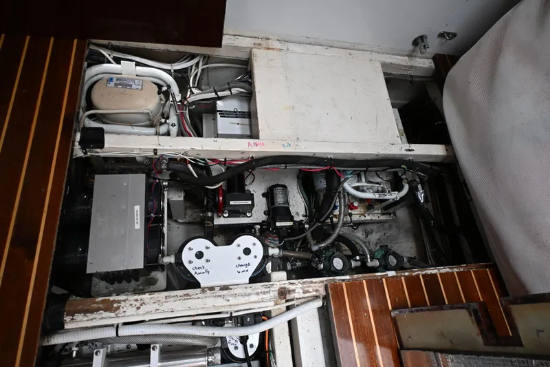 Slide: The Image of Engine compartment of a 1968 Abeking & Rasmussen Tripp 74 yacht, showcasing mechanical components. - 27