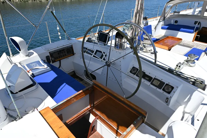 Slide: The Image of Cockpit of 1968 Abeking & Rasmussen Tripp 74 yacht with steering wheel and navigation instruments. - 29