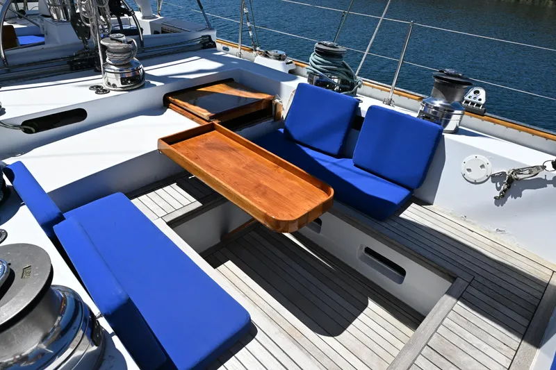 Slide: The Image of Cockpit of 1968 Abeking & Rasmussen Tripp 74 yacht with blue cushions and wooden table. - 31