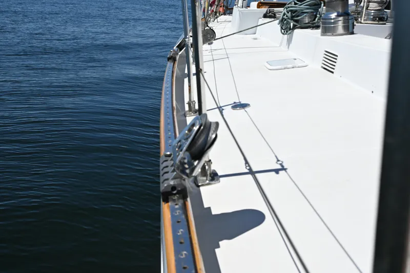 Slide: The Image of Deck view of a 1968 Abeking & Rasmussen Tripp 74 yacht on calm water. - 35