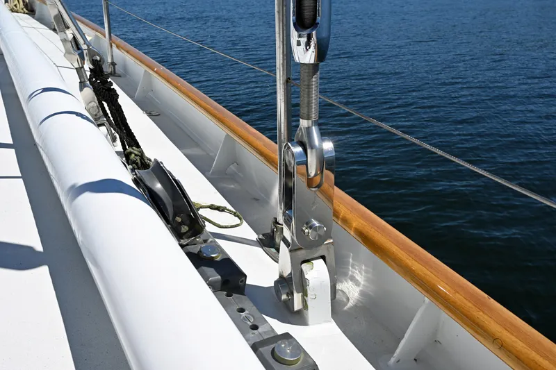 Slide: The Image of Deck view of 1968 Abeking & Rasmussen Tripp 74 yacht, showcasing rigging and polished woodwork. - 38