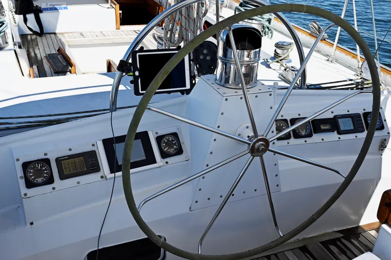 Slide: The Image of Steering wheel of a 1968 Abeking & Rasmussen Tripp 74 yacht with navigation instruments. - 43