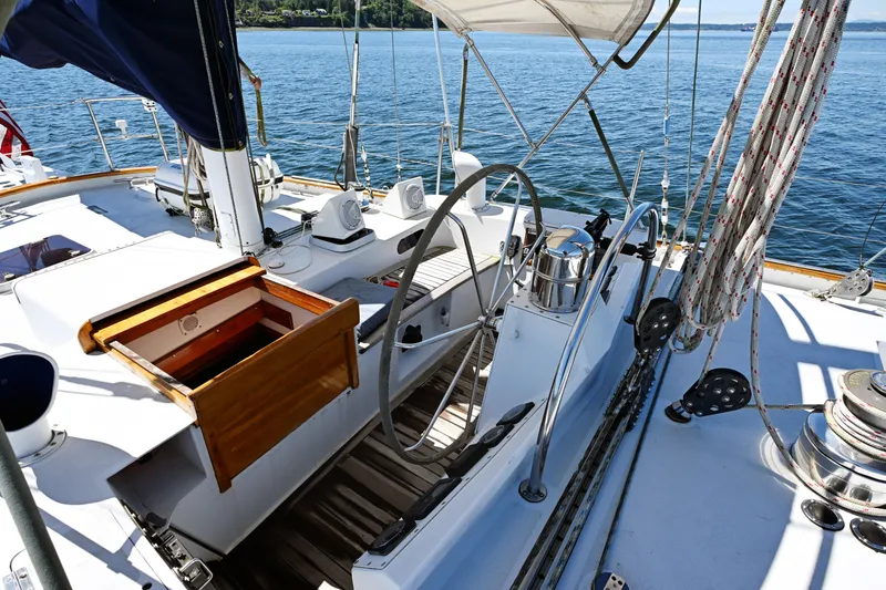 Slide: The Image of Cockpit of 1968 Abeking & Rasmussen Tripp 74 sailboat with steering wheel and ropes. - 44