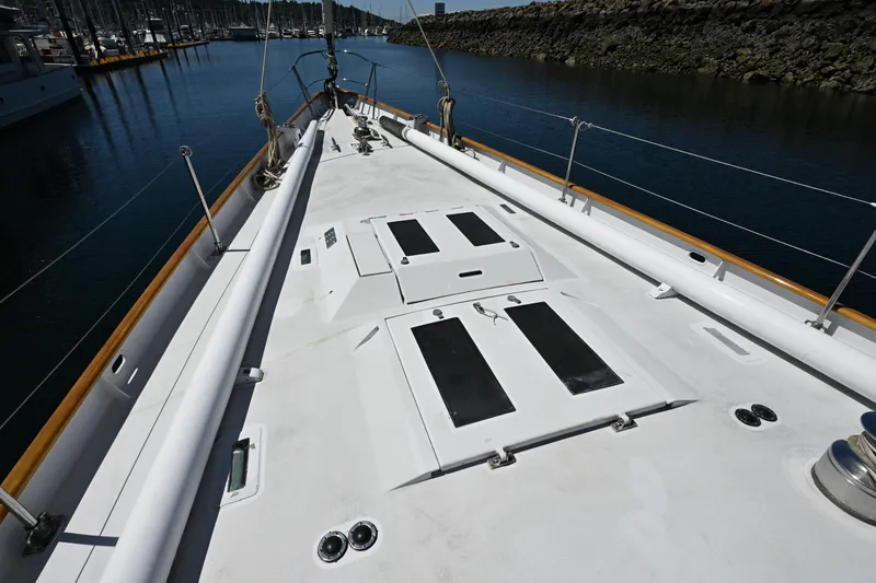Slide: The Image of Deck view of 1968 Abeking & Rasmussen Tripp 74 yacht in a marina setting. - 51