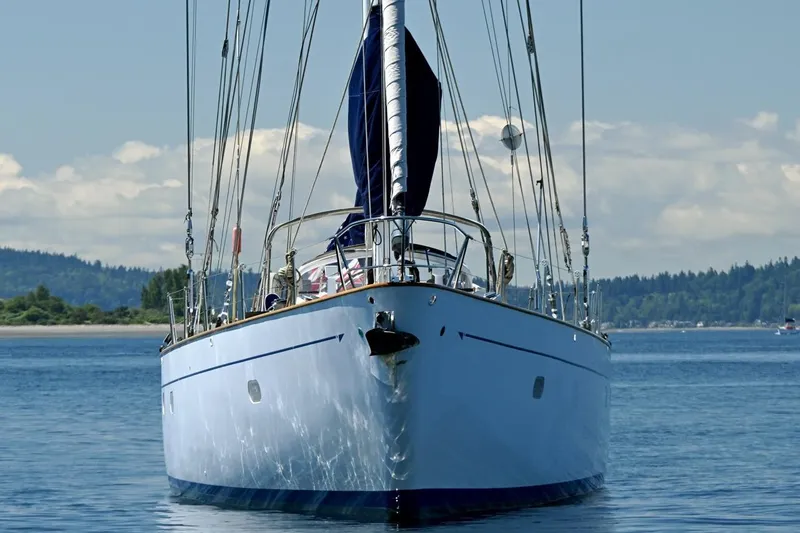 Slide: The Image of Front view of a 1968 Abeking & Rasmussen Tripp 74 yacht on calm waters. - 56