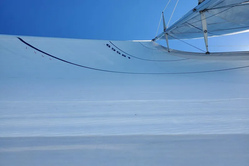 Slide: The Image of Sail of Abeking & Rasmussen Tripp 74 yacht, 1968, against clear blue sky. - 65