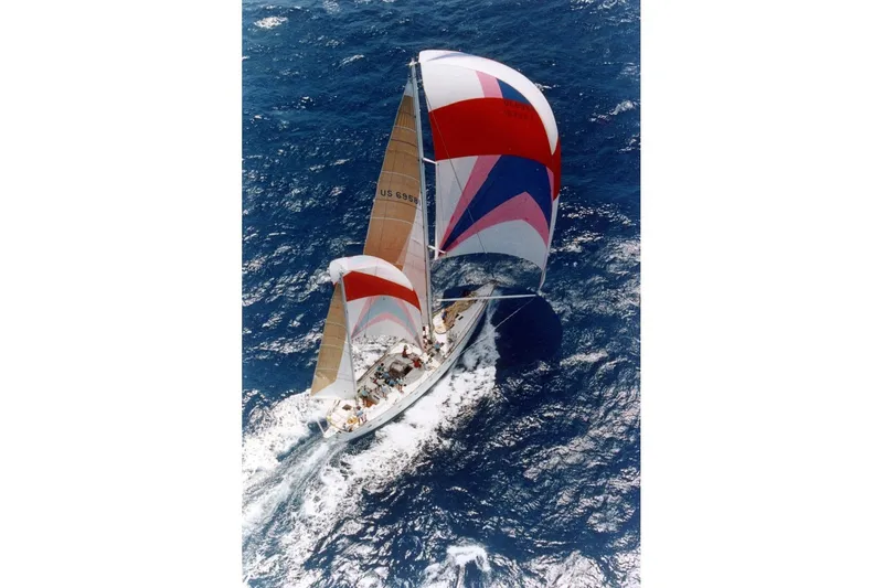Slide: The Image of Sailing yacht Abeking & Rasmussen Tripp 74, 1968, navigating ocean waters with colorful sails. - 66