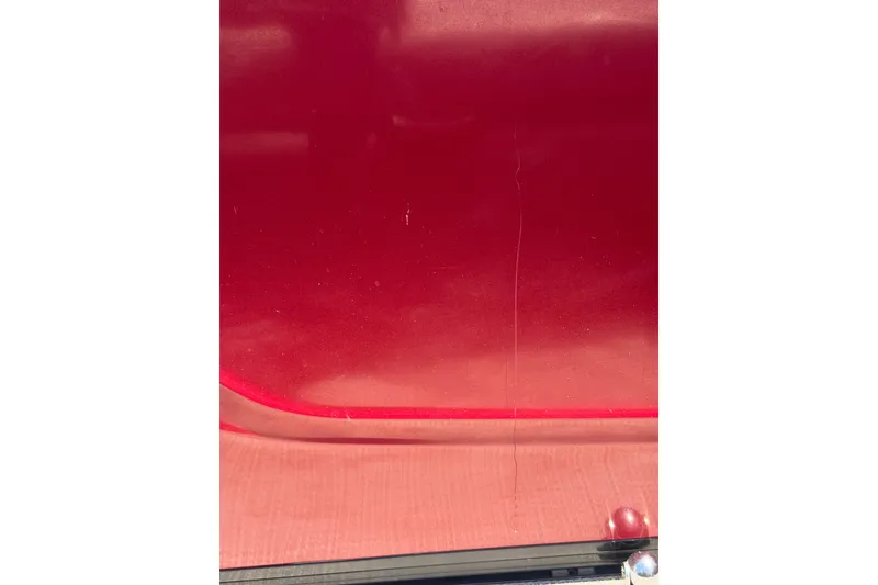 Slide: The Image of Red exterior of 2024 Regency R250DL3 vehicle, showcasing sleek design and glossy finish. - 13