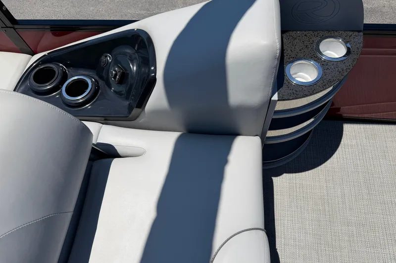Slide: The Image of 2024 Regency R250DL3 boat interior with cup holders and luxurious seating. - 22