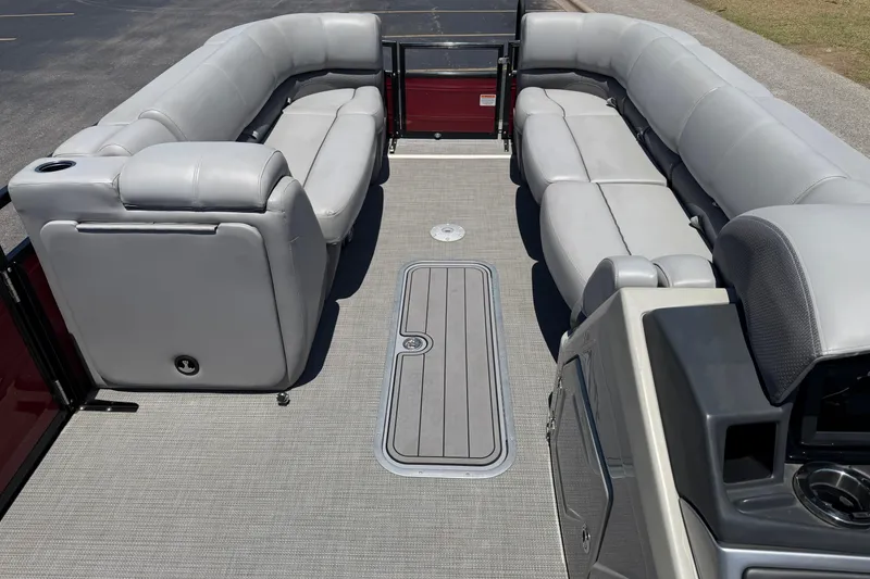 Slide: The Image of 2024 Regency R250DL3 pontoon boat interior with gray seating and modern design. - 26