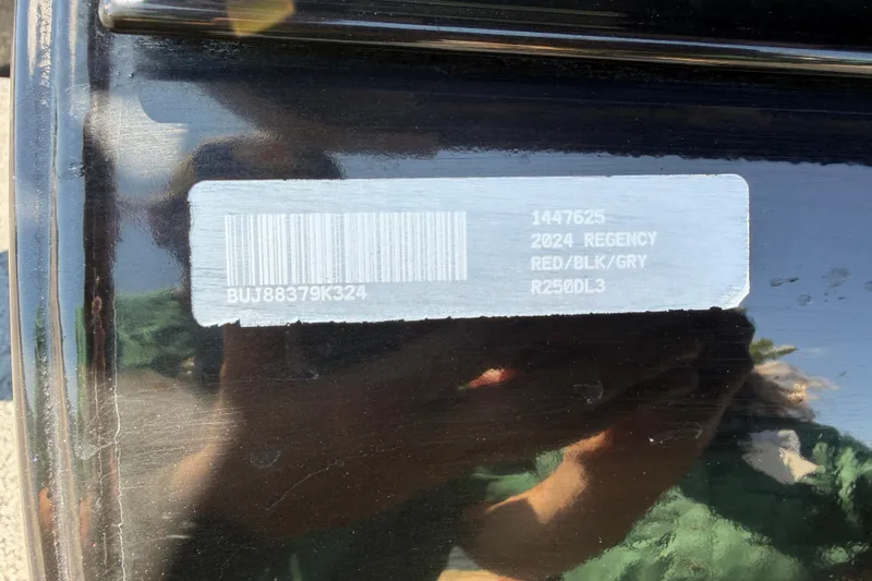 Slide: The Image of Barcode label on 2024 Regency R250DL3, red/black/grey color scheme. - 32