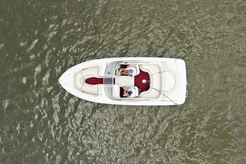 Slide: The Image of Overhead view of 1997 Sea Ray 230 Signature boat on water. - 6