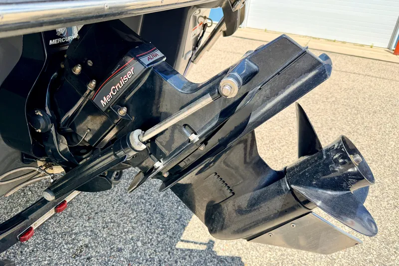 Slide: The Image of 2018 Glastron GT 185 MerCruiser Alpha One outdrive, close-up view. - 16