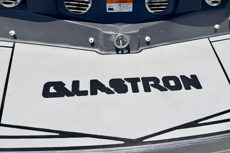 Slide: The Image of 2018 Glastron GT 185 boat logo on deck, featuring bold black lettering. - 18