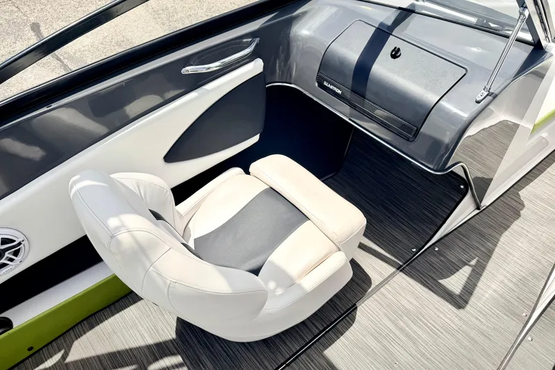 Slide: The Image of 2018 Glastron GT 185 boat interior with sleek seating and modern dashboard design. - 27
