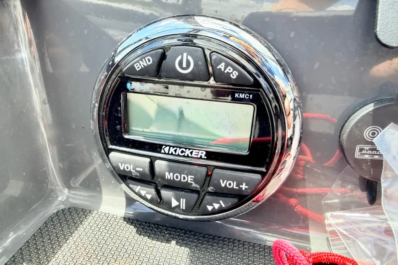 Slide: The Image of Kicker KMC1 audio system on 2018 Glastron GT 185 boat dashboard. - 30