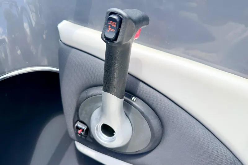 Slide: The Image of Throttle control lever of a 2018 Glastron GT 185 boat. - 33