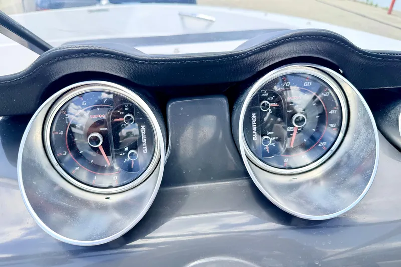 Slide: The Image of Dashboard of 2018 Glastron GT 185 boat showing RPM and speed gauges. - 35