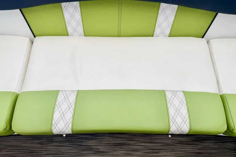 Slide: The Image of Green and white seating on 2018 Glastron GT 185 boat, featuring plaid accents. - 45