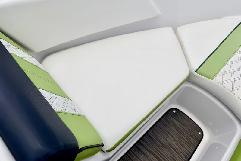 Slide: The Image of 2018 Glastron GT 185 boat interior with stylish green and white seating. - 54