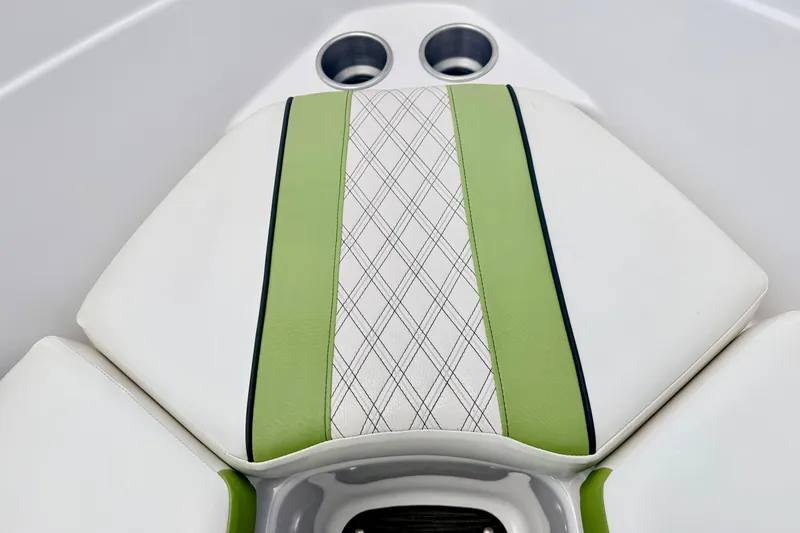 Slide: The Image of 2018 Glastron GT 185 boat interior with green and white cushioned seating. - 58