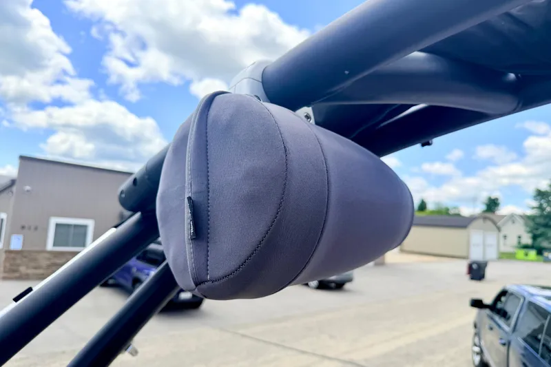 Slide: The Image of Close-up of a 2018 Glastron GT 185 boat speaker with protective cover. - 62