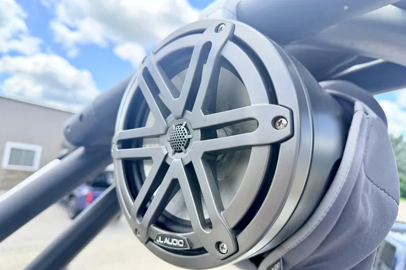 Slide: The Image of Close-up of JL Audio speaker on 2018 Glastron GT 185 boat, under a blue sky. - 63