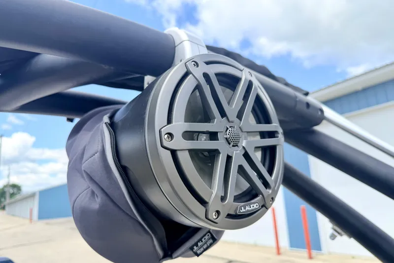 Slide: The Image of Close-up of JL Audio speaker on 2018 Glastron GT 185 boat, under blue sky. - 65