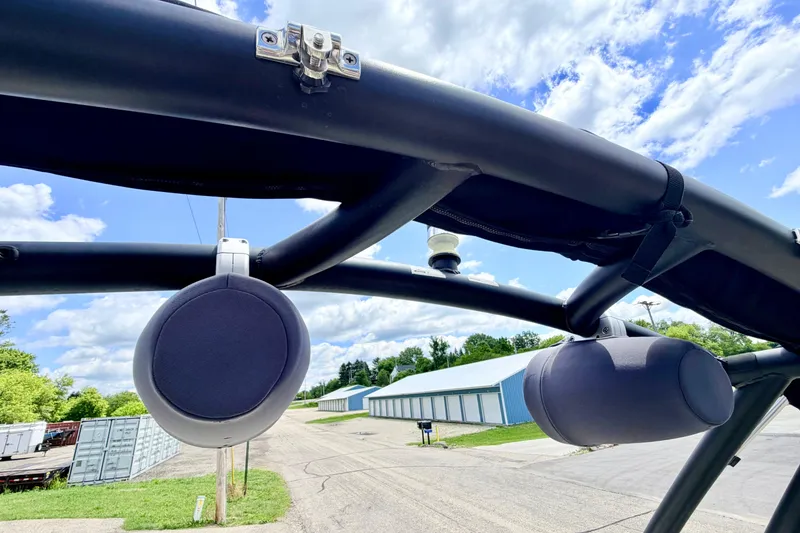 Slide: The Image of Speakers mounted on a 2018 Glastron GT 185 boat against a blue sky background. - 66