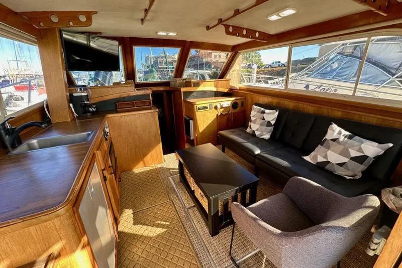 Slide: The Image of Interior of a 1985 Egg Harbor 33 Sedan yacht with cozy seating and modern amenities. - 21