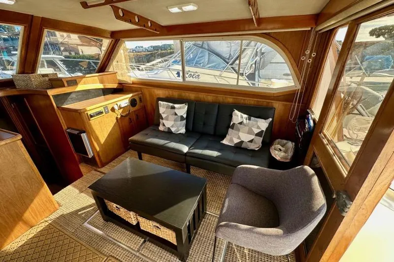 Slide: The Image of Interior of 1985 Egg Harbor 33 Sedan with modern seating and wooden accents. - 22
