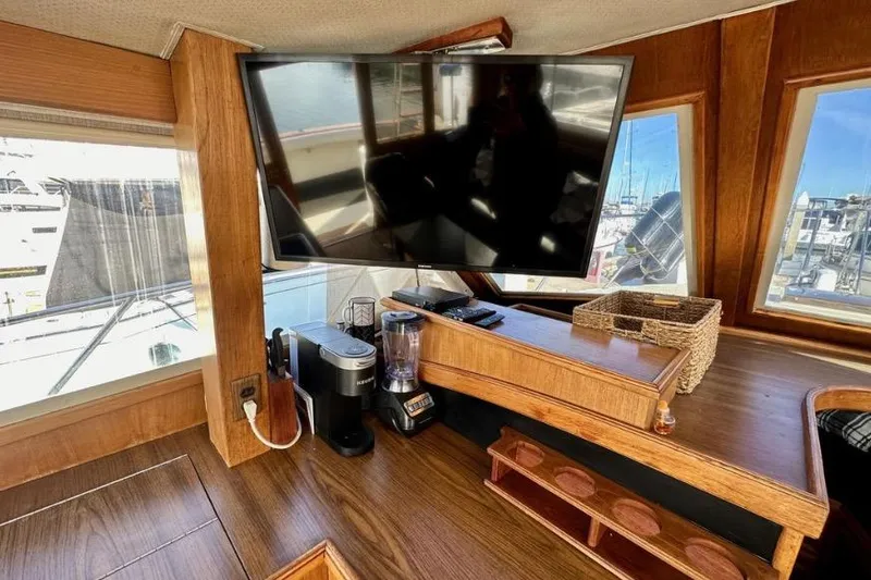 Slide: The Image of Interior of 1985 Egg Harbor 33 Sedan with TV, coffee maker, and blender on wooden counter. - 25