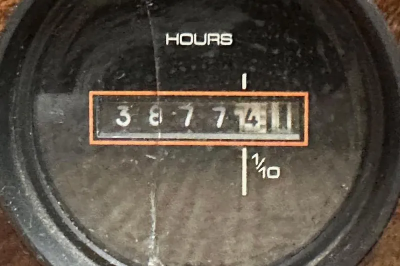 Slide: The Image of Hour meter reading 3877.4 on a 1985 Egg Harbor 33 Sedan boat. - 30