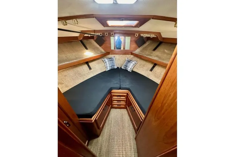 Slide: The Image of Interior cabin of 1985 Egg Harbor 33 Sedan with cozy bedding and wooden finish. - 37