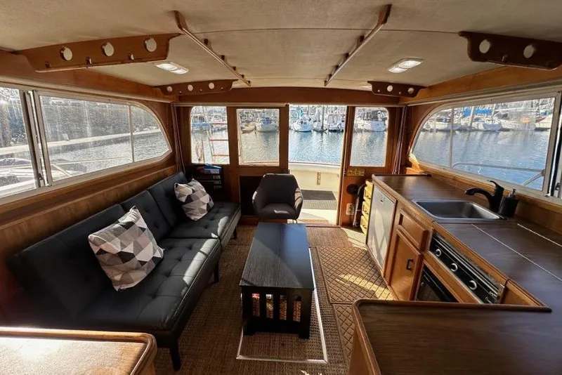 Slide: The Image of Interior of 1985 Egg Harbor 33 Sedan yacht with modern furnishings and marina view. - 44