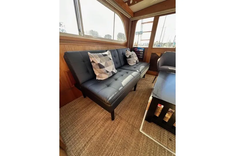 Slide: The Image of Interior of 1985 Egg Harbor 33 Sedan with modern sofa and geometric pillows. - 45