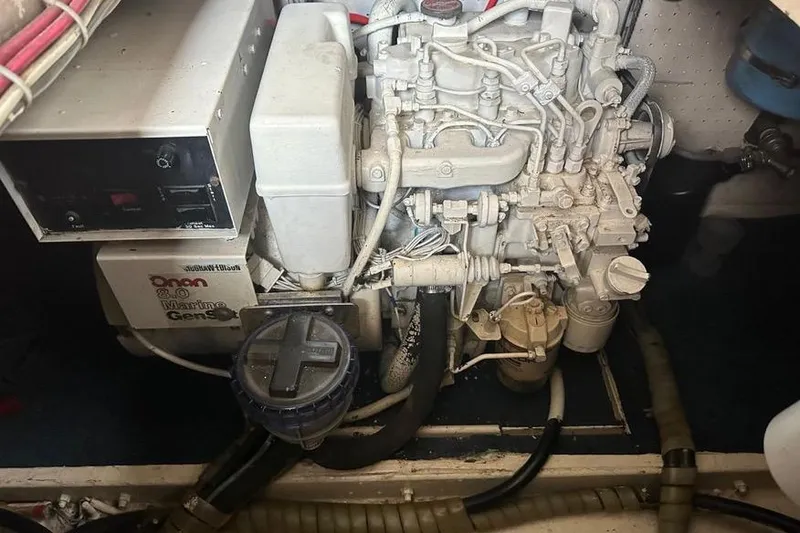 Slide: The Image of Engine room of a 1985 Egg Harbor 33 Sedan with Onan marine generator. - 48