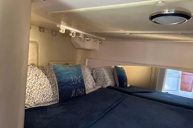 Slide: The Image of Cozy cabin interior of 2007 Grady-White Express 360 with decorative pillows and bedding. - 10