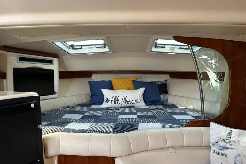 Slide: The Image of Luxurious cabin interior of 2007 Grady-White Express 360 boat with cozy bedding. - 11