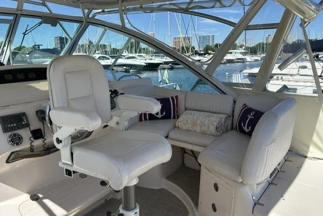 Slide: The Image of 2007 Grady-White Express 360 boat interior with white seating and marina view. - 66