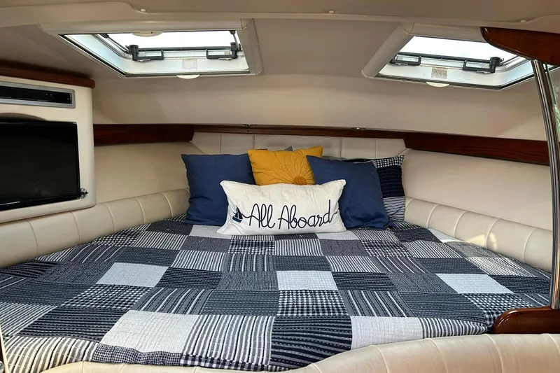 Slide: The Image of Cozy cabin interior of 2007 Grady-White Express 360 with quilted bedding and decorative pillows. - 15