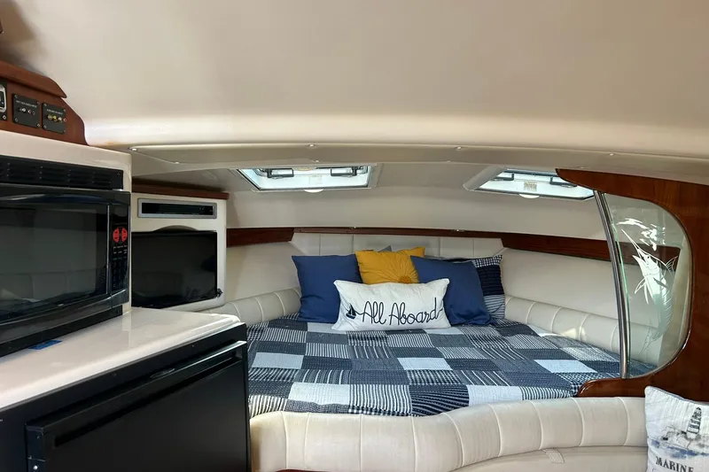 Slide: The Image of Interior of 2007 Grady-White Express 360 boat with cozy bed and modern amenities. - 16