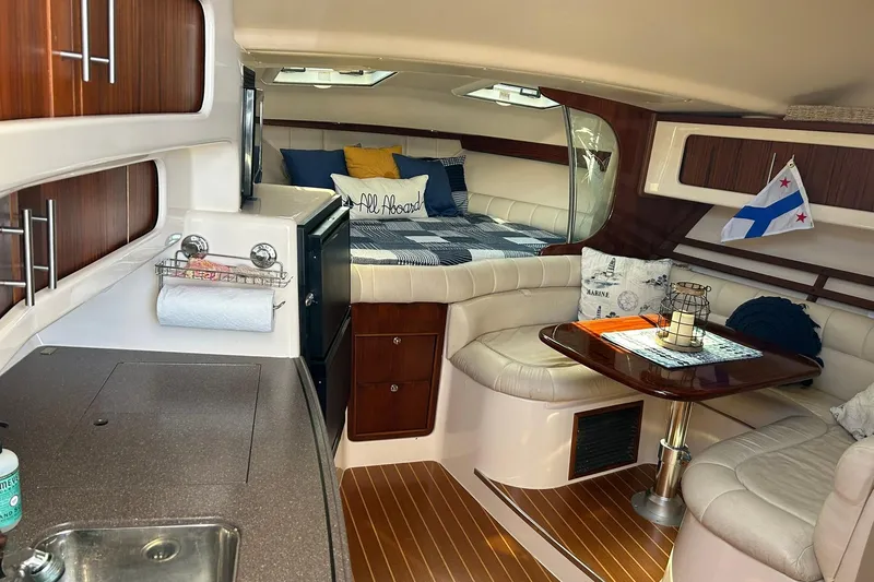 Slide: The Image of Interior of 2007 Grady-White Express 360 boat with cozy seating and kitchenette. - 24