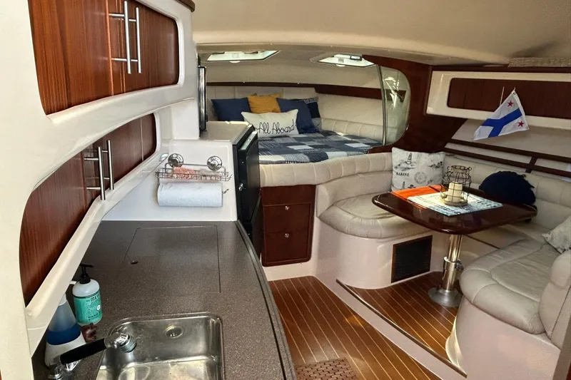 Slide: The Image of Luxurious 2007 Grady-White Express 360 cabin interior with kitchenette and cozy seating area. - 25